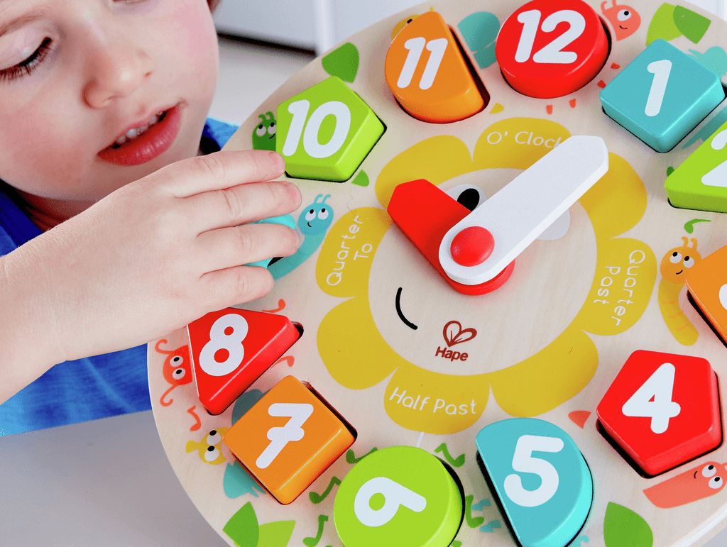 Ceas educativ din lemn Hape cu forme geometrice si cifre, 24,5 cm