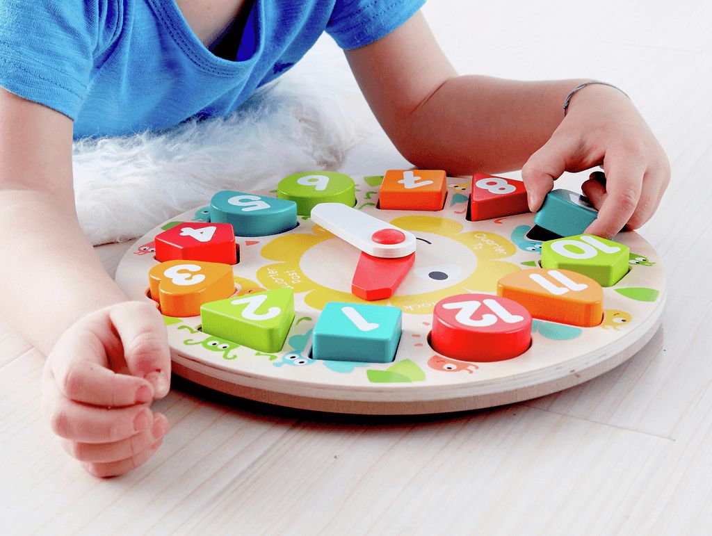 Ceas educativ din lemn Hape cu forme geometrice si cifre, 24,5 cm