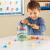 Set pentru sortat si numarat - Dinozauri jucausi (72 piese) PlayLearn Toys