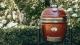 Grill ceramic cu cărbuni JUNIOR Pro Serie 2.0 roșu cu suport metalic, Monolith Essential GrillCooking