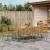 Set de Masă pentru Grădină  cu 9 Piese Gri Rattan Polimeric Acacia, Scaune Stivuibile pentru Grădină  cu Perne 2 buc Gri Rattan Polimeric GartenMobel Dekor