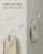 SONGMICS Set 4 carlige perete, design oval din otel, 5 kg per carlig, 9x5x7 cm, alb perlat Household NewTrend