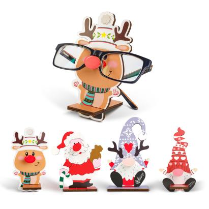 Suport decorativ de masă pentru ochelari – 14 x 10 cm – model Moș, ren, spiriduș sau om de zăpadă – din lemn MDF Best CarHome
