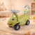 Masinuta fara pedale, model dinozaur, volan muzical, 50x21.5x33 cm, verde MultiMark GlobalProd